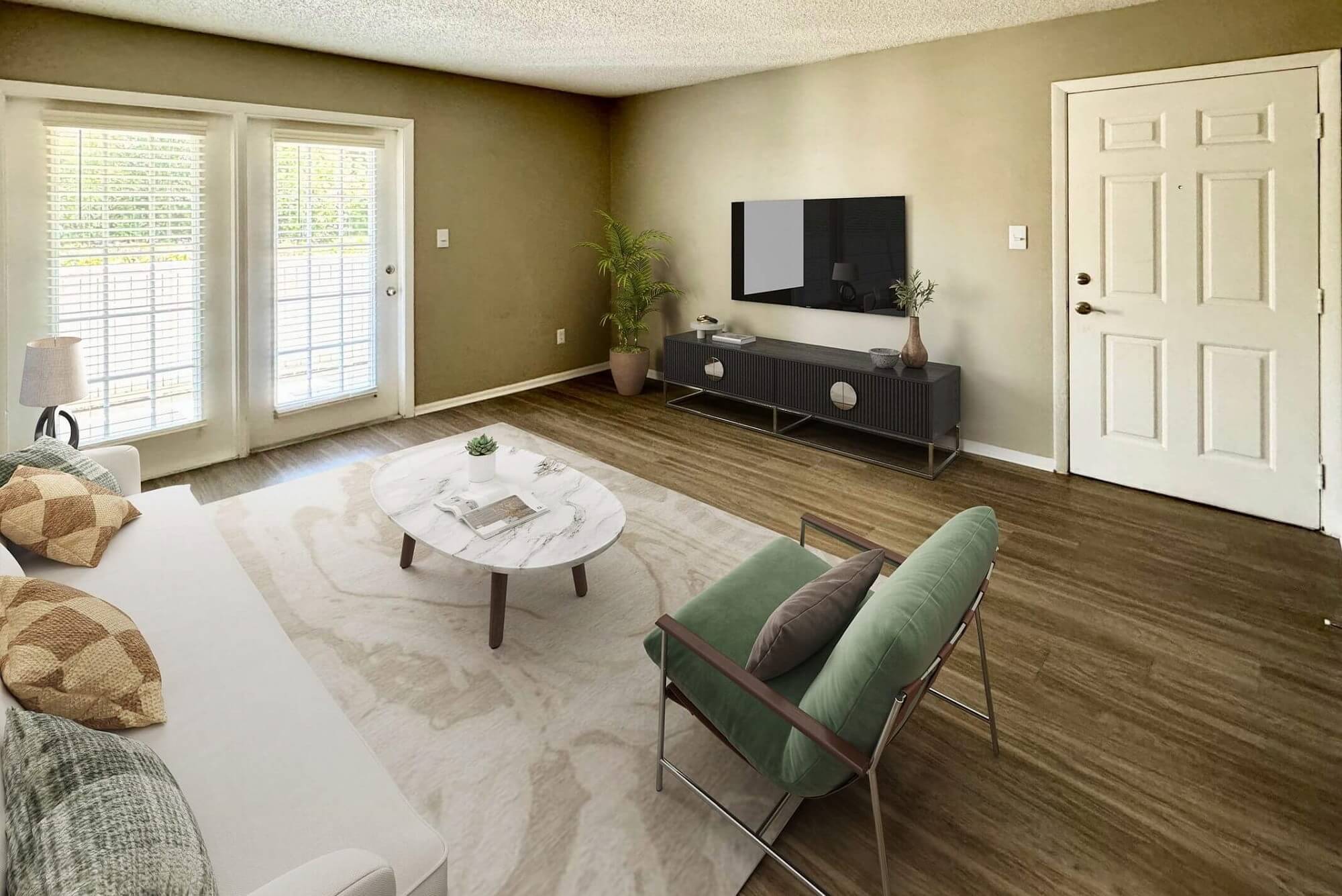 living room with wood-style flooring, mounted television, door to patio access, and couch seating.