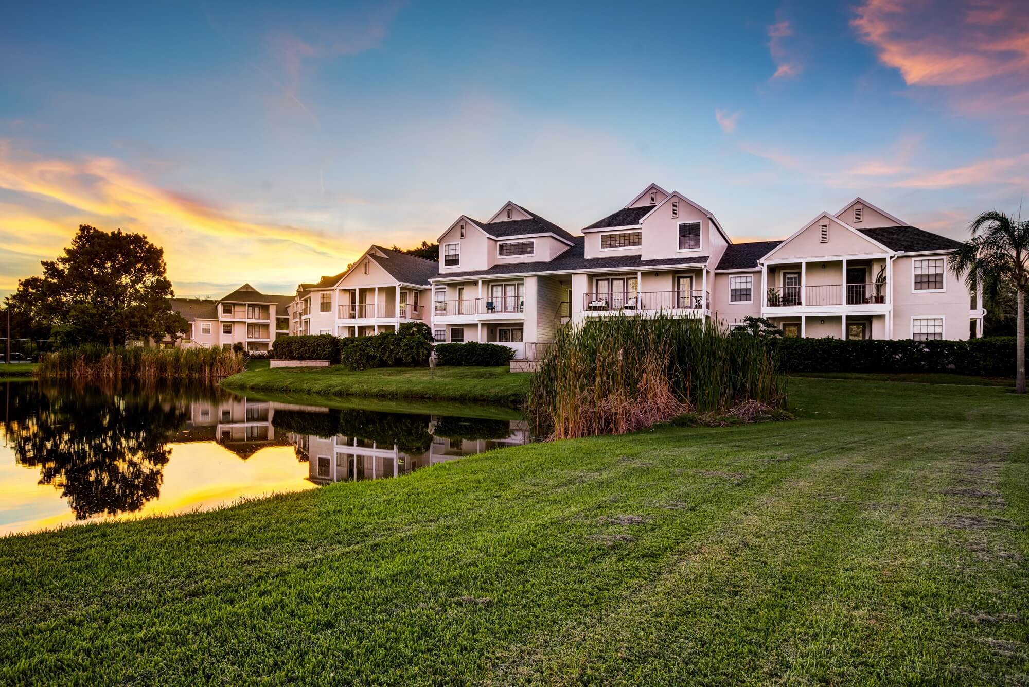sunset view of property overlooking the lake.